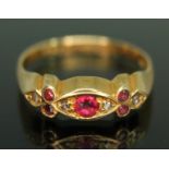 An 18ct gold red paste and diamond ring, sponsor's mark 'T&AH', Birmingham 1942, gross wt. 2.23g,