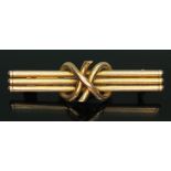 A bar brooch marked '15c', length 36mm, wt. 2.33g.