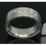 A 18ct white gold diamond eternity ring by Niessing, total approx. diamond wt. 0.46 carats, inverted