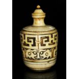 A Chinese ivory snuff bottle, of barrel form and carved with archaic designs, height 83mm.
