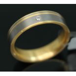 A yellow metal and titanium wedding band by Feniom, inverted D-section, alternate colours to outer