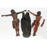 Two carved wood crucifixes and a flat back religious figure depicting the Virgin Mary and baby