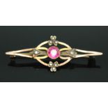 An early 20th century pink sapphire and split pearl brooch, length 45mm, marked '9ct', gross wt. 2.