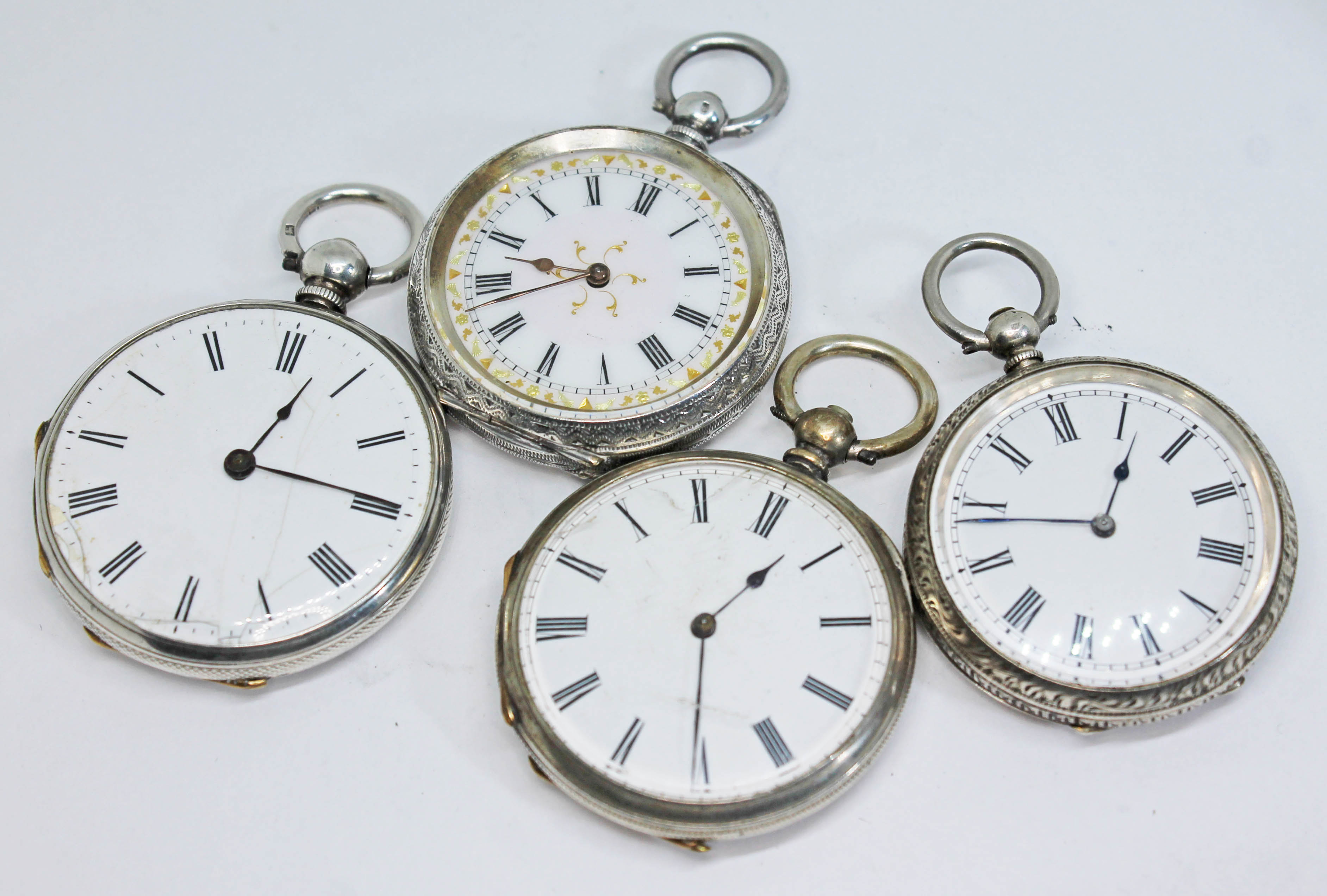 Four antique continental silver open face key wind ladies pocket watches, two marked 'fine silver'