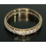 An eternity ring set with colourless stones, marked '9ct', gross wt. 2.11g, size P/Q.