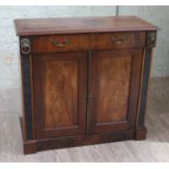 A 19th century mahogany cabinet, two drawers with lion mask handles either side, lower cabinet,