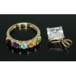 A hallmarked 9ct gold multi-gemstone ring size M, together with a princess cut aquamarine pendant