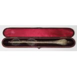 A Victorian cased white metal lorgnette.