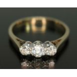 A three stone diamond ring, three Old European cut diamonds weighing approx. 0.30 carats in total,