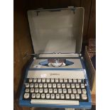 A vintage Imperial teal blue portable typewriter