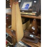 An early 20th century oak and vellum table lamp in the form of a boat.