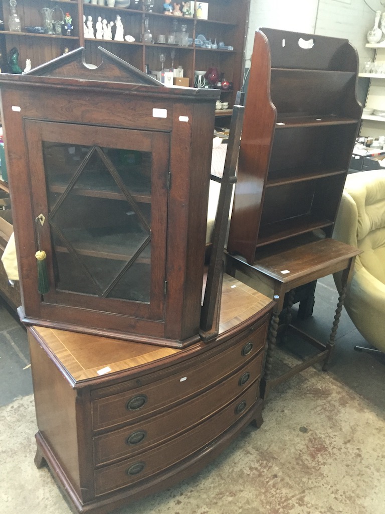 A bow fronted inlaid mahogany chest of drawers, a glazed corner cabinet, a corner table, a barley