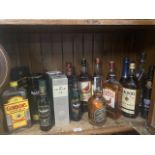 A collection of alcoholic beverages to include Tatcher's, Glenifiddic, Black Label, Chivas Regal,