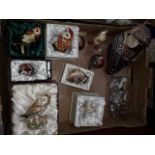 A box of assorted owl hidden treasure trinket boxes (some with charms) and a small collection of