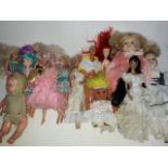 A box of mainly Barbie dolls and similar.