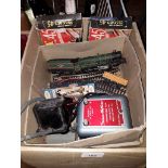 A box containing various controller units (Triang, Hornby etc), a Hornby model train, some track and