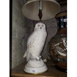 A Franklin Mint porcelain table lamp modelled as a snowy owl, by Raymond Watson