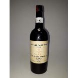 A bottle of W & J Graham vintage port wine, 1955, bottled 1957, level- high shoulder.