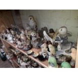 A large collection of owl ornaments to include Regency, Wade and Franklin Porcelain etc.