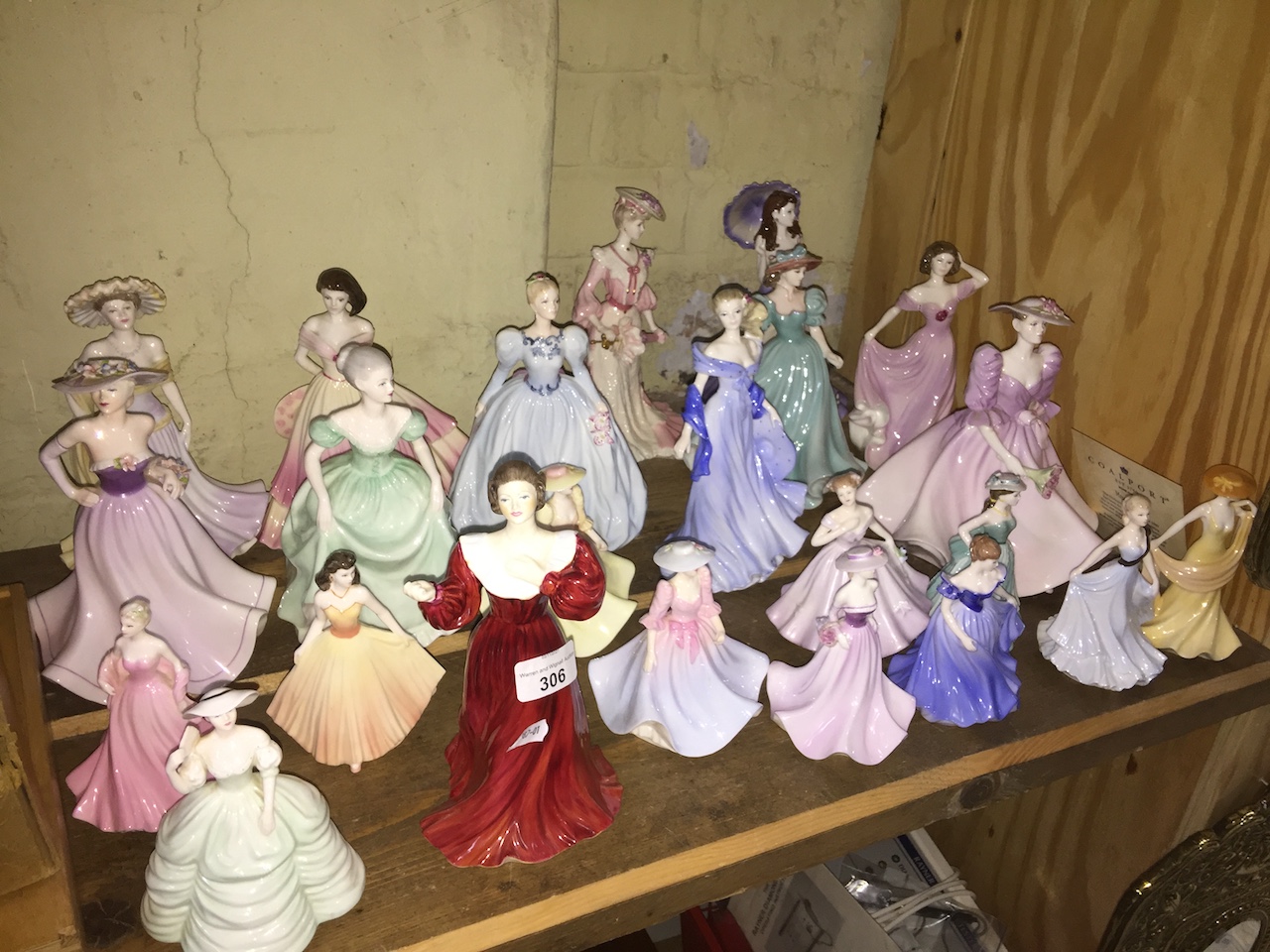 A collection of 23 Coalport figurines, Ladies of Fashion etc, various sizes.