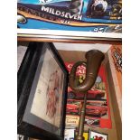 A box containing 3 vintage car badges, brass motor horn, 2 Ford limited edition prints, Jensen