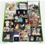 A box of assorted owl costume jewellery.
