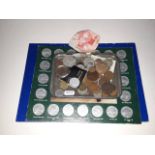 A quantity of assorted coins including a Victoria florin, two commemorative coins sets and two