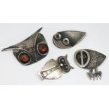 Two stylised brooches modelled as owl heads by Frances Holmes Boothby marked 'fhb Sterling',