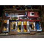 A box of boxed Corgi and Matchbox die-cast vehicles.