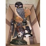 A box of assorted owl door stops comprising seven cast metal and one wooden.