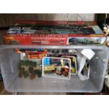 A box containing various die-cast model vehicles, model train items, controller etc and a hornby