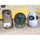 A group of three glass owl paperweights comprising Whitefriars, Wedgwood and John Ditchfield
