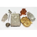 Assorted novelty owl items comprising a white emtal spoon, a silver plated note pad, a brass vesta