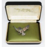 A Scottish hallmarked silver brooch by Ola M Gorie, modelled as an owl in flight, with box.