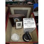 A small box containing two Victor Cast Ware Ltd. owl string dispensers (one in box), a small