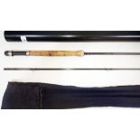 A Japanese made 10'7" two part carbon fly fishing rod, with bag and rod tube. Good condition, some