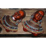 A pair of Masai wall masks by Handarbeit, length 38cm each. Condition - good, minor loses only.