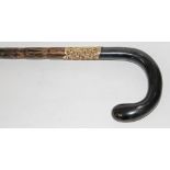 A horn handled bamboo walking stick with gold plated collar, length 92cm.
