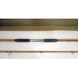 A vintage Hardy 'Longbow' 11'5" two piece beach fishing rod, 2-4oz, with rod bag. Some signs of use/