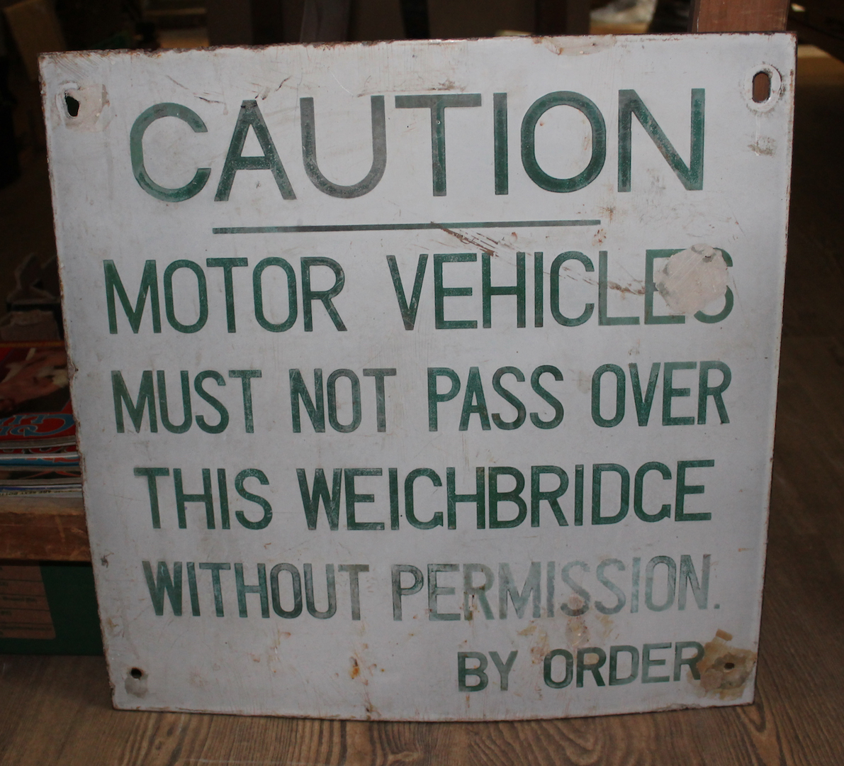 An enamel sign "Caution Motor Vehicles Must Not Pass Over this Weighbridge Without Permission by