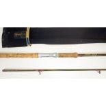 A Hardy Favourite 11' two piece graphite spinning rod, 1 1/2oz with rod bag. Good condition, some