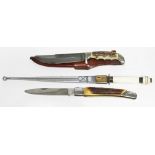 Two hunting knives: one inscribed 'The Original Trapper' to blade together with an eastern