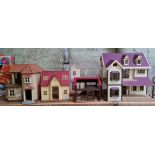 A collection of doll houses to iclude a barn and church etc.