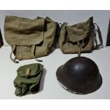 3 military satchels and a metal military helmet