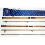 Two Diawa Graphite Salmon spinning rods; a 12' three piece Bait Spin Special and another similar 2