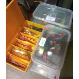 Three boxes containing a large number of lures, spinners and spoons.