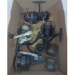 Box containg 4 course fishing reels including Mitchell 3350Z and spare spools. All apear to be in