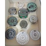 A box containing 7 fly fishing reels; a Redinton CT 5/6 fly reel, Shakespeare 4 1/4" Beaulite fly