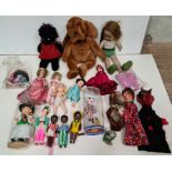 A box of various vintage dolls