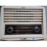 A vintage cream bakelite Bush radio.